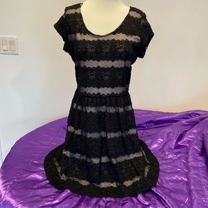 Candie’s black and lilac fully lined dress with bow accent on back